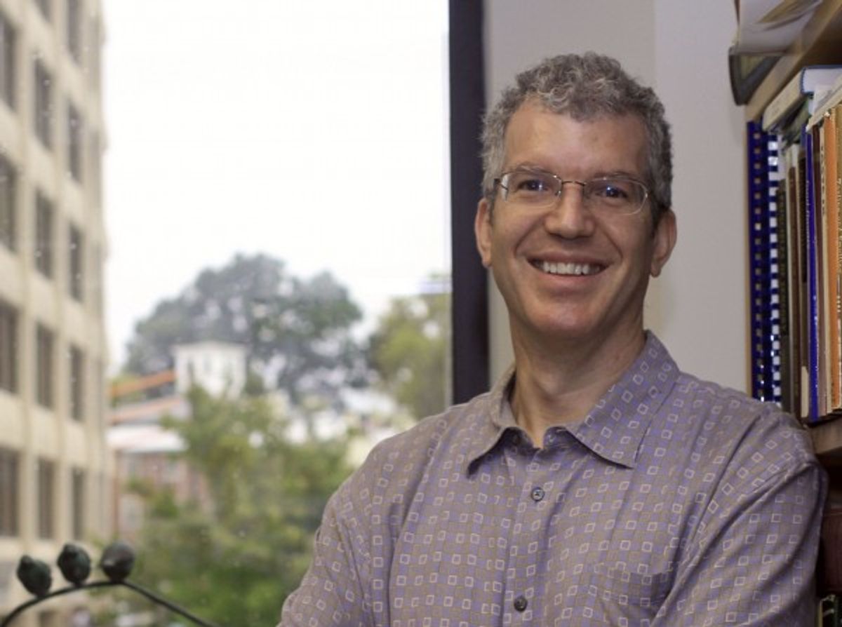 Image of Paul Breslin. He is wearing glasses and a patterned shirt and smiles at the camera. Image of Paul Breslin. He is wearing glasses and a patterned shirt and smiles at the camera.