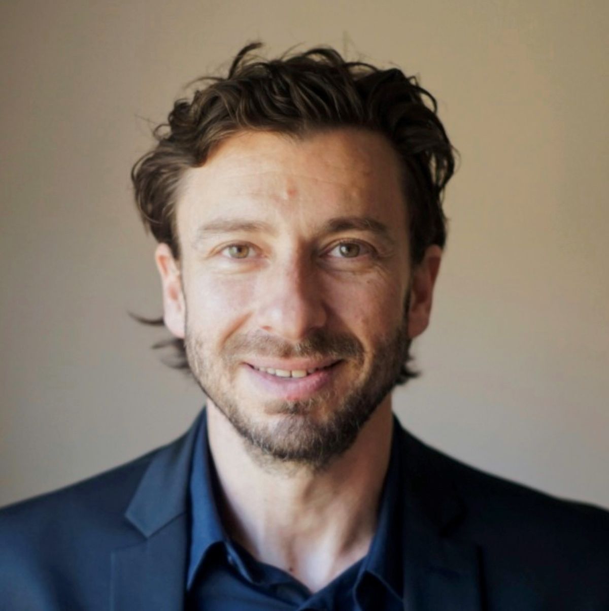 A photograph of David Furman, an immunologist and data scientist at the Buck Institute and Stanford University. Furman has dark brown hair, wears a dark blue dress shirt and jacket, and is looking at the camera. A photograph of David Furman, an immunologist and data scientist at the Buck Institute and Stanford University. Furman has dark brown hair, wears a dark blue dress shirt and jacket, and is looking at the camera.