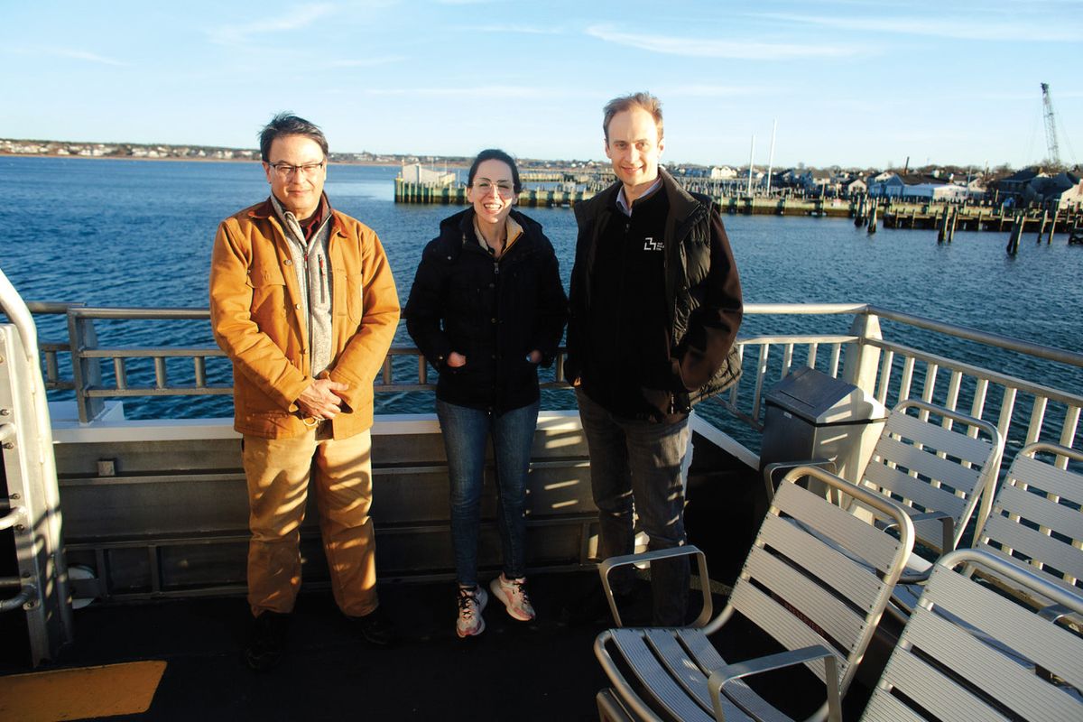 Sam Telford III, Joanna Buchthal, and Kevin Esvelt stand outside on a dock on a sunny day. Sam Telford III, Joanna Buchthal, and Kevin Esvelt stand outside on a dock on a sunny day.