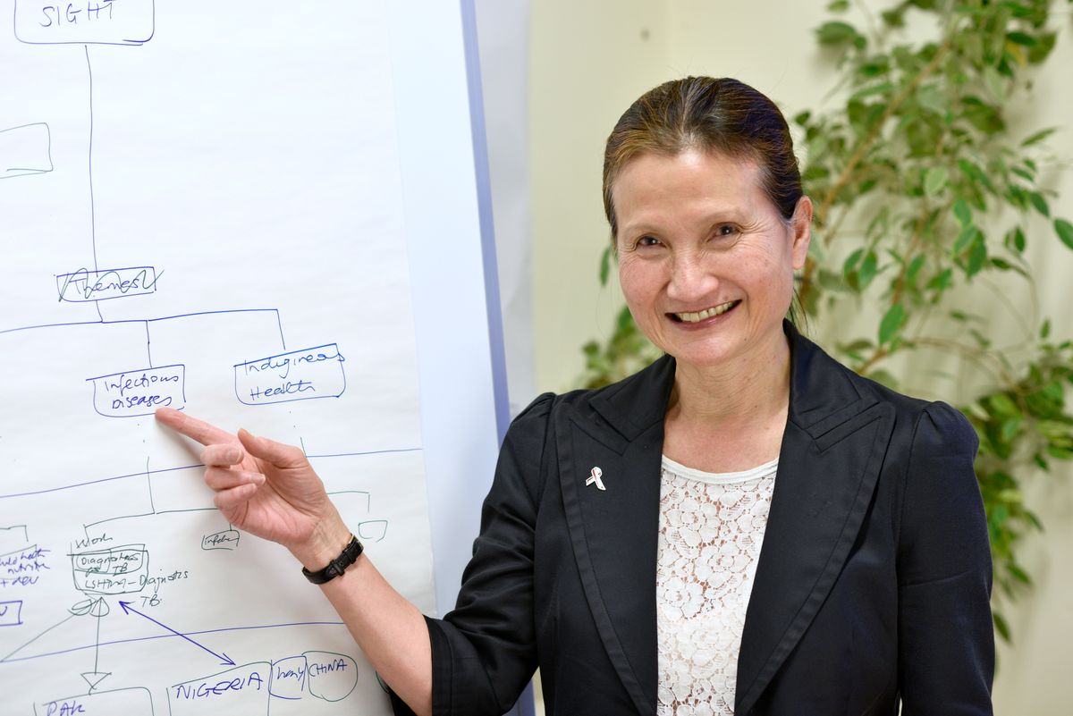 Rosanna Peeling pointing at a flow chart labeled “Infectious Diseases”. Rosanna Peeling pointing at a flow chart labeled “Infectious Diseases”.