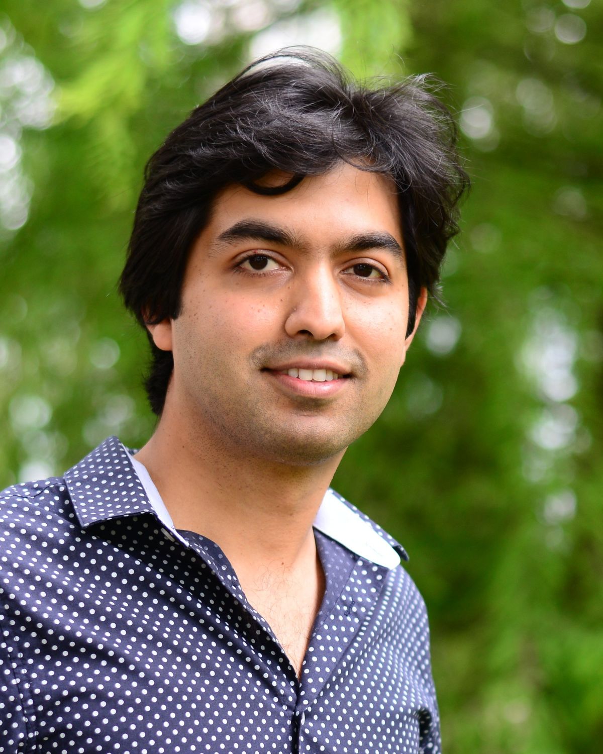A picture of the biophysicist Siddharth Deshpande against a green backdrop. A picture of the biophysicist Siddharth Deshpande against a green backdrop.
