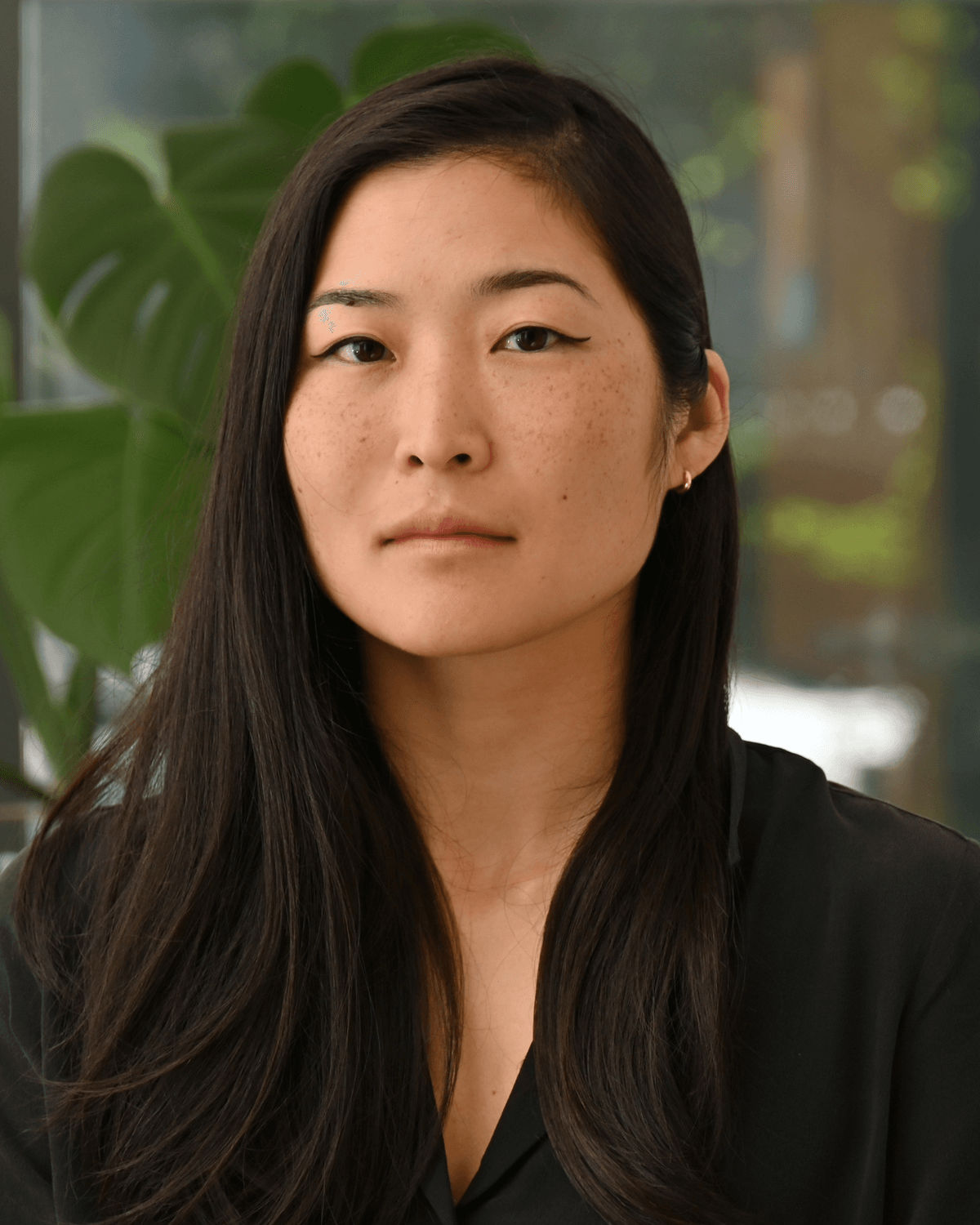 Christina Kim, a neuroscientist and bioengineer at the Institute for Psychedelics and Neurotherapeutics at the University of California, Davis poses for a photo wearing a black shirt, with a plant in the background. Christina Kim, a neuroscientist and bioengineer at the Institute for Psychedelics and Neurotherapeutics at the University of California, Davis poses for a photo wearing a black shirt, with a plant in the background.